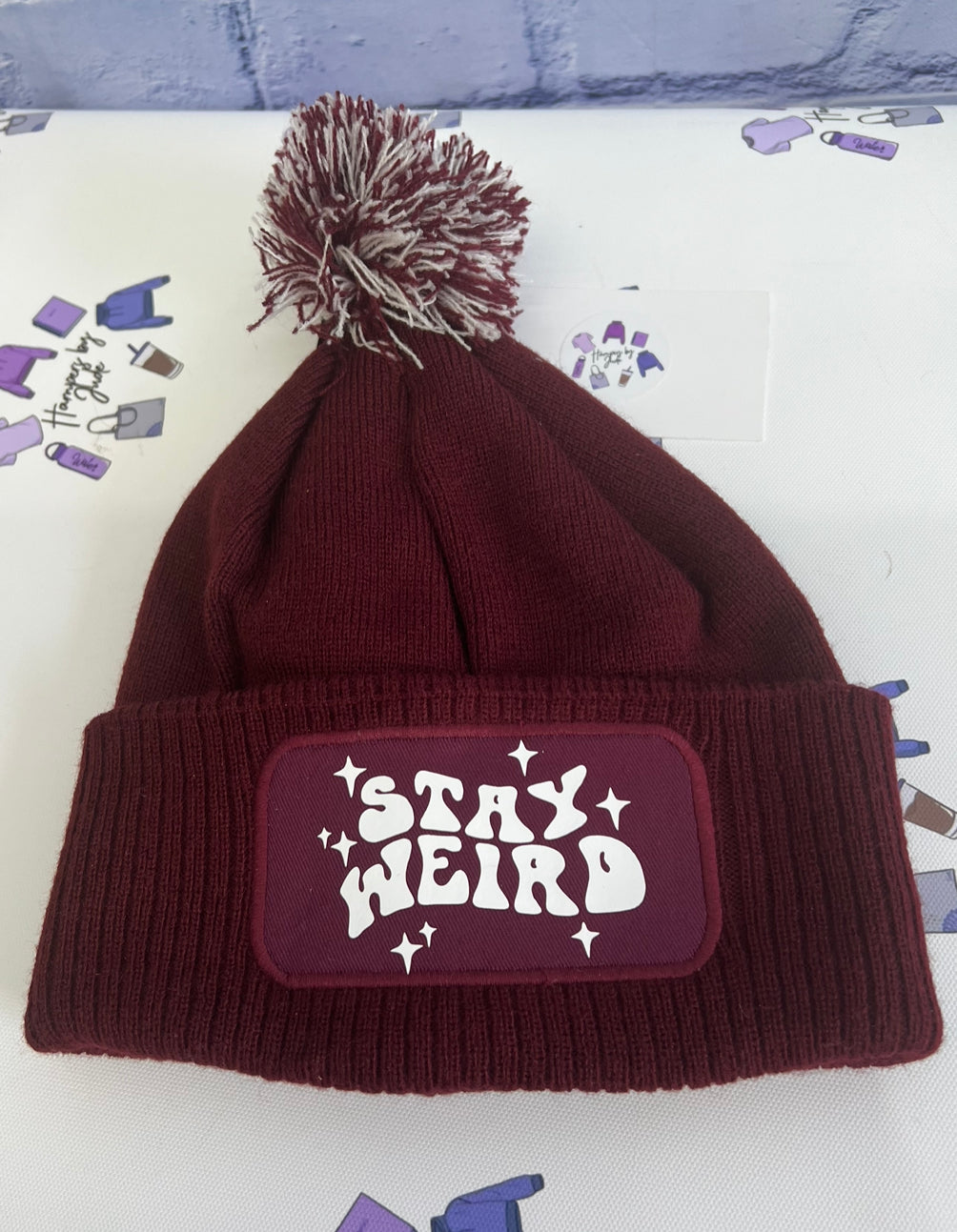 Stay weird bobble hat